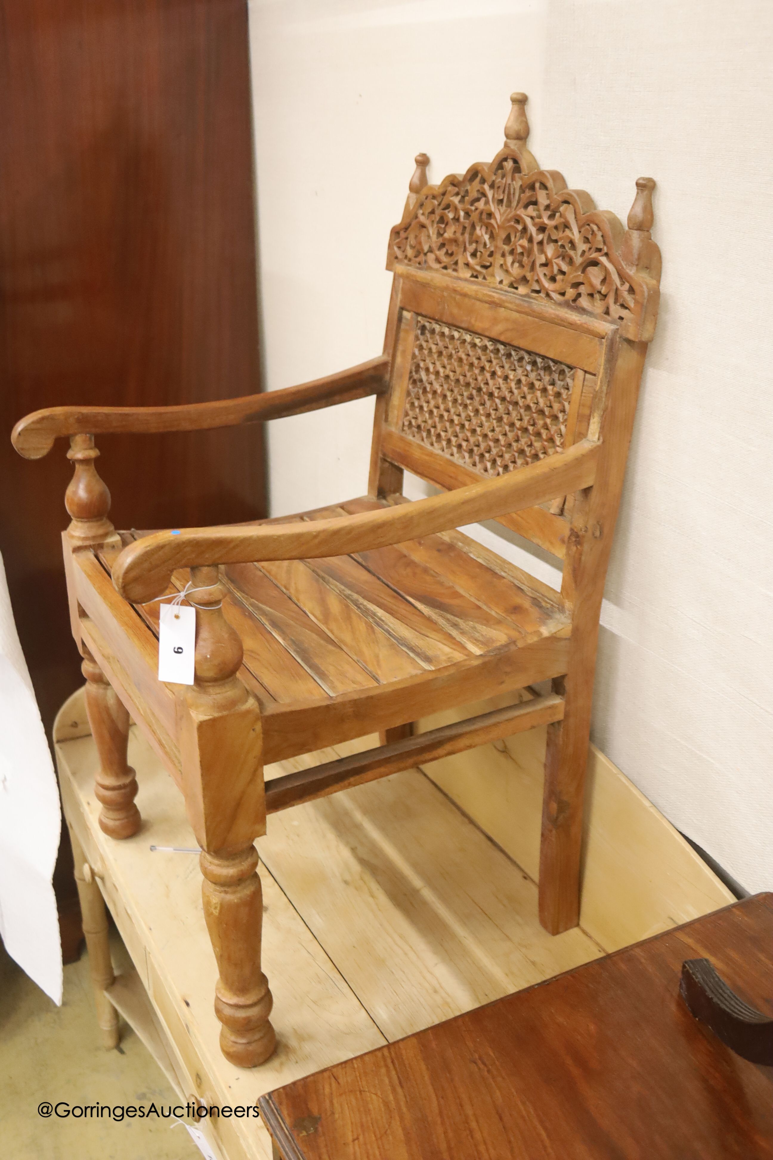 An Anglo-Indian carved hardwood elbow chair, width 55cm, depth 48cm, height 98cm